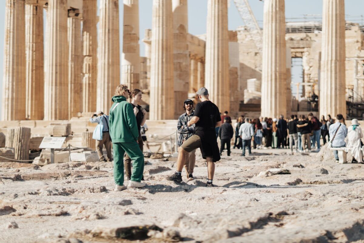 services-03 A group of tourists exploring the ancient ruins of the Parthenon in Athens, Greece.